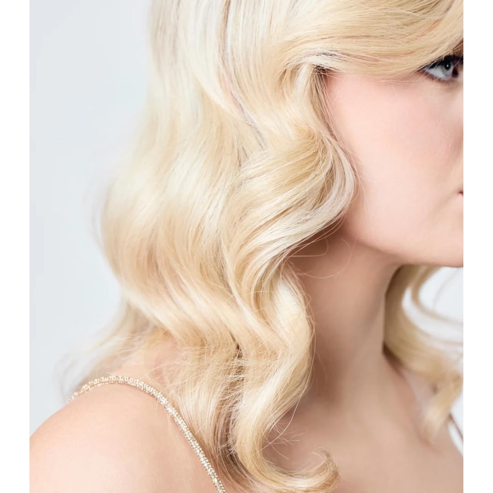 AIIR Shine Spray mist dispersion on hair for even shine and sleek texture.