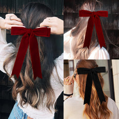 Detail view of Aileam alligator clip securing velvet bow