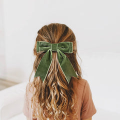 Aileam green velvet bow close-up fabric texture highlighting premium velvet.
