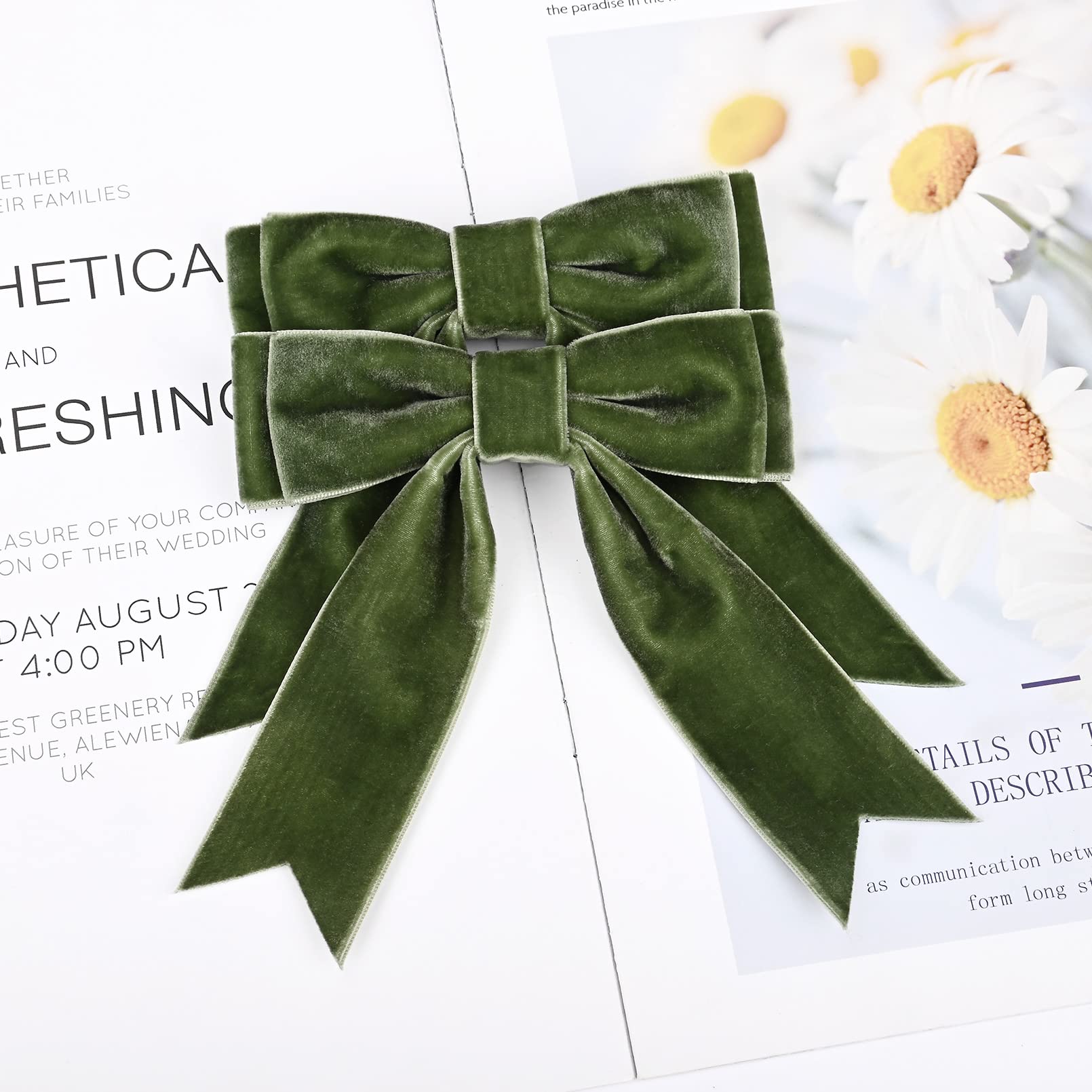 Aileam green velvet bow worn on head illustrating easy styling.