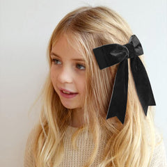 Aileam handcrafted velvet bows celebrate tiny moments with style.