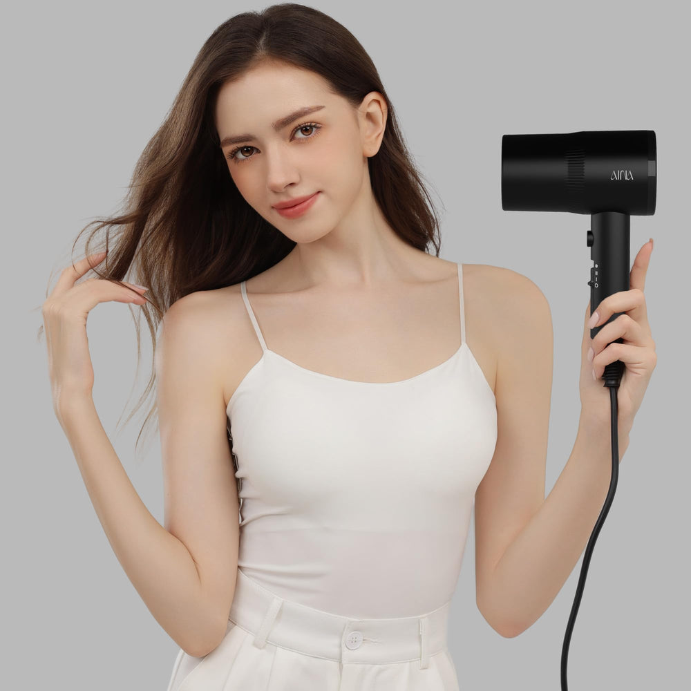 AINA hair dryer 4-layer safety filter protects airflow during drying.