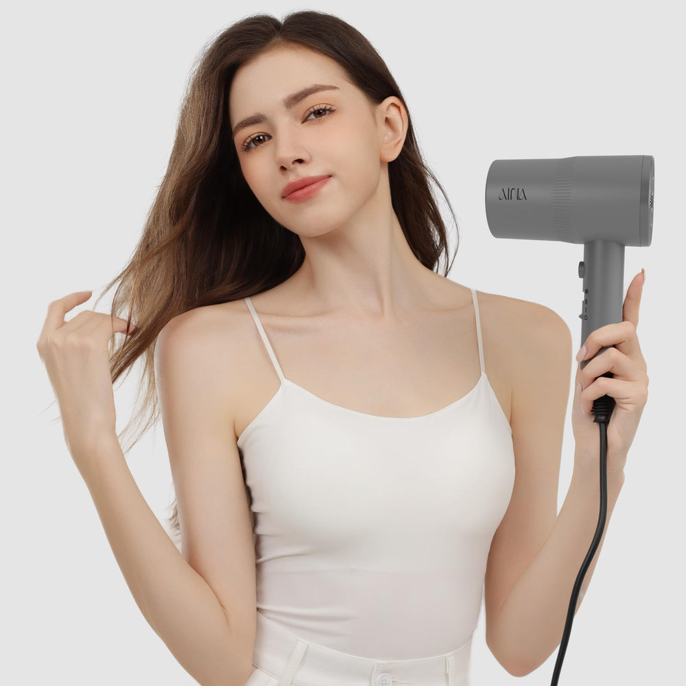 Aina hair dryer with turbo heat for faster drying and shiny finish.