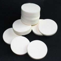 AKOAK round powder puff in white, soft sponge for smooth, even makeup application.