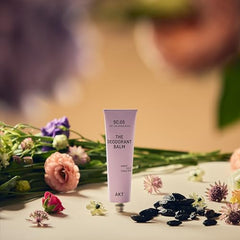 AKT Deodorant Balm in hand reveals creamy texture ready for absorption.