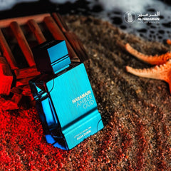 Al Haramain Amber Oud Aqua Dubai logo detail emphasizes luxury branding and authenticity.