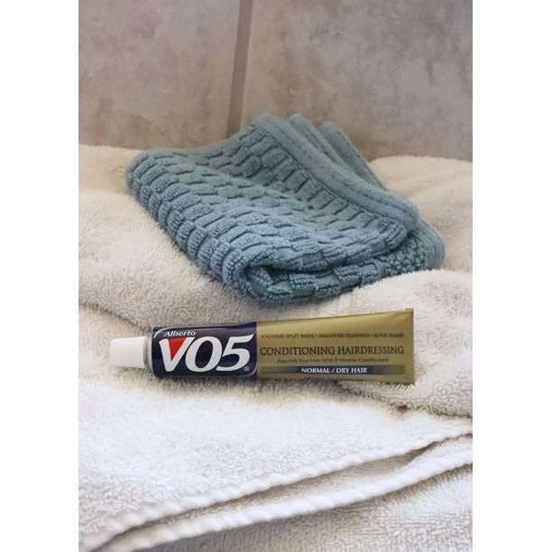Alberto VO5 Conditioning Hairdressing shown in a detangling routine for easy combing.