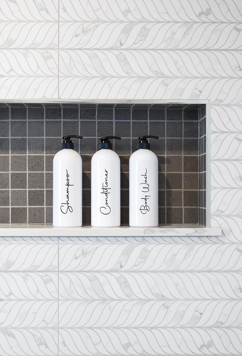 Alora set enhances shower organization in a stylish bathroom.