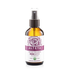 Alteya Organics Rose Water toner bottle on vanity for gentle skin hydration