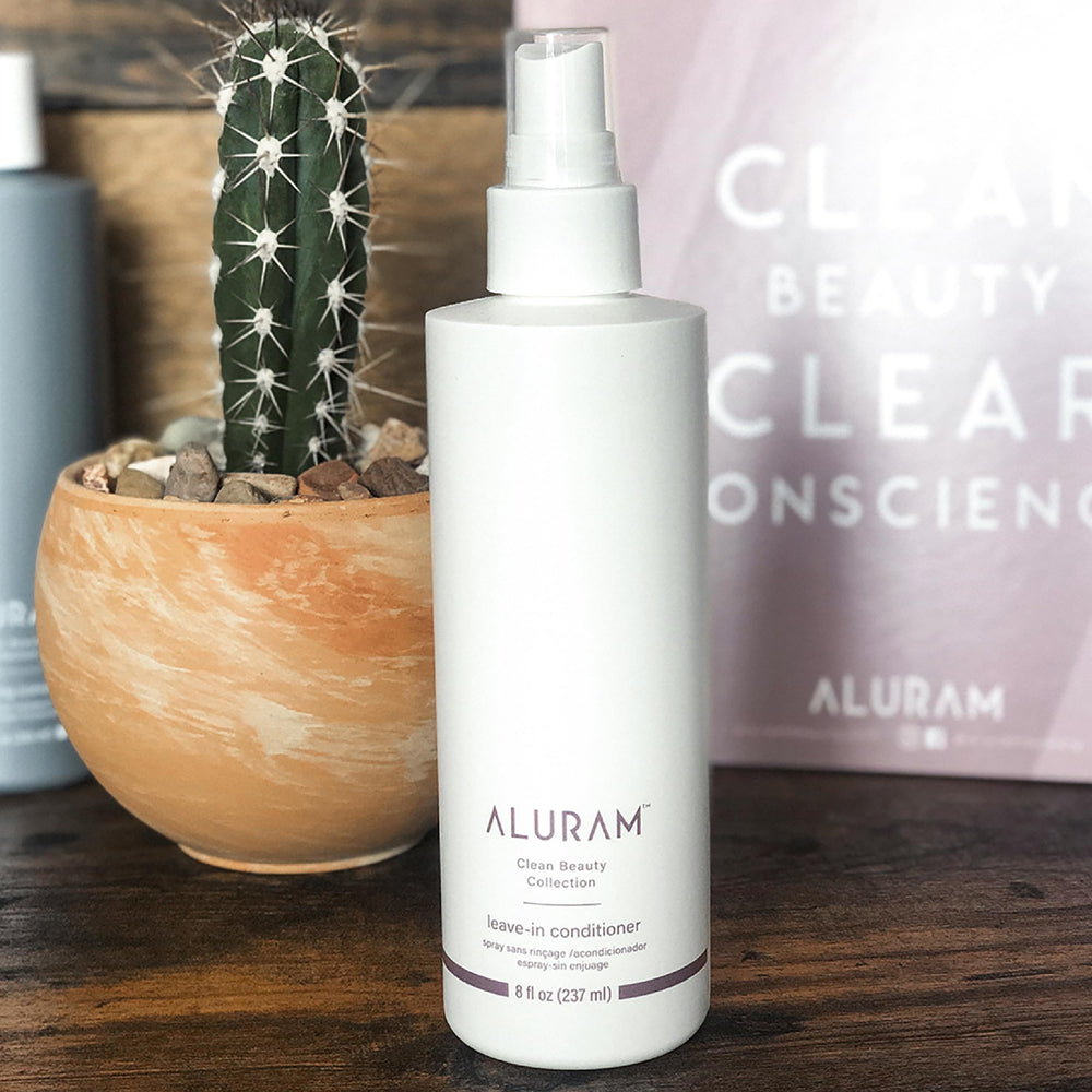 ALURAM Coconut Water Leave-In spray application demonstrates detangling and easy styling prep.