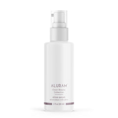 ALURAM Coconut Water Shine Serum bottle closeup shows frizz control and radiant gloss