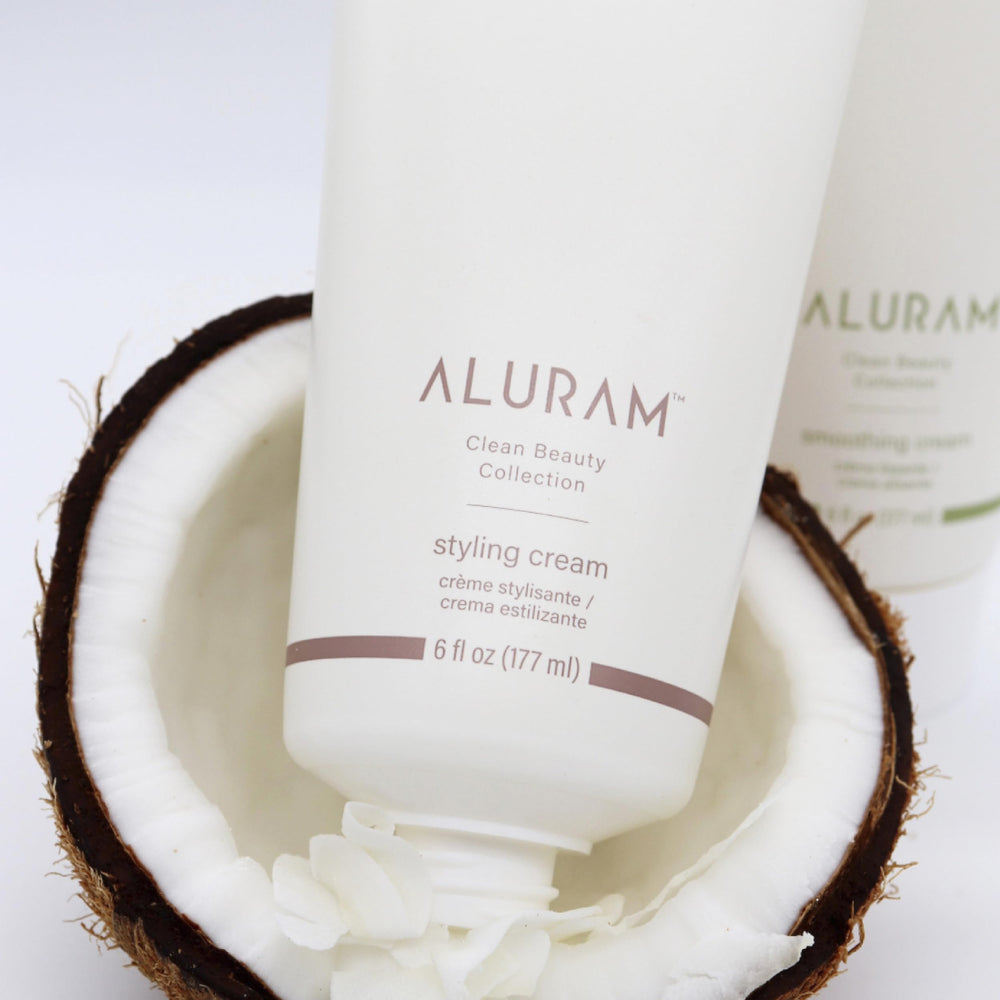 ALURAM Coconut Water Styling Cream hair definition on strand for sleek polish.