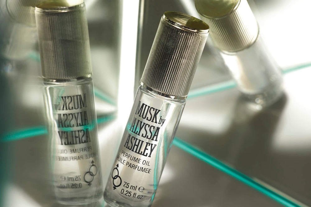 Dispense drop of Alyssa Ashley Musk perfume oil for precise application.
