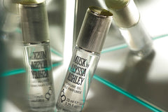 Dispense drop of Alyssa Ashley Musk perfume oil for precise application.
