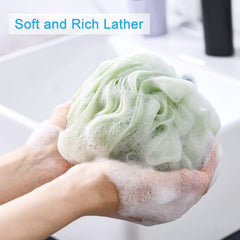 A AmazerBath loofah sponge close-up shows dense mesh for rich lather