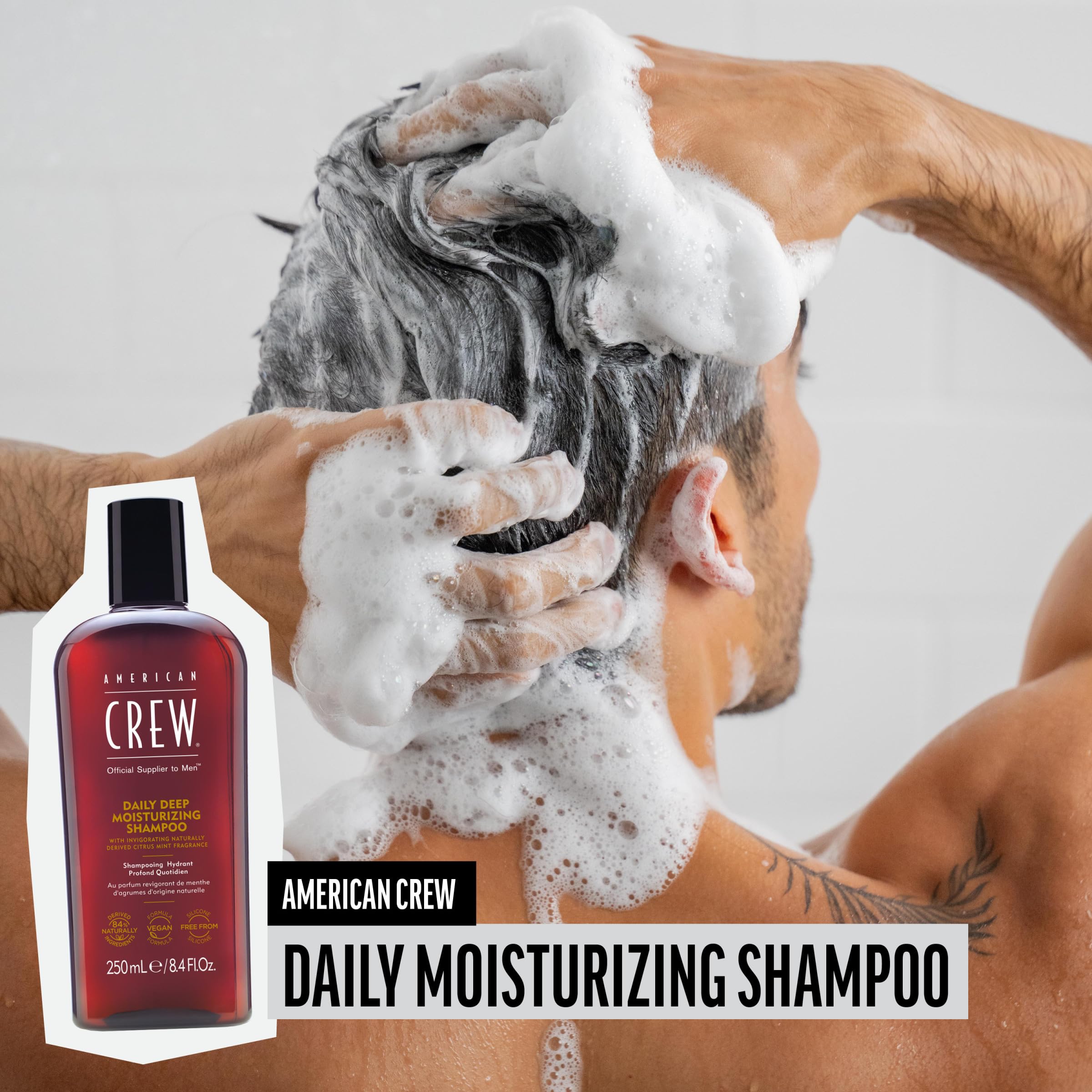 American Crew shampoo being poured, showing rich lather for cleansing.