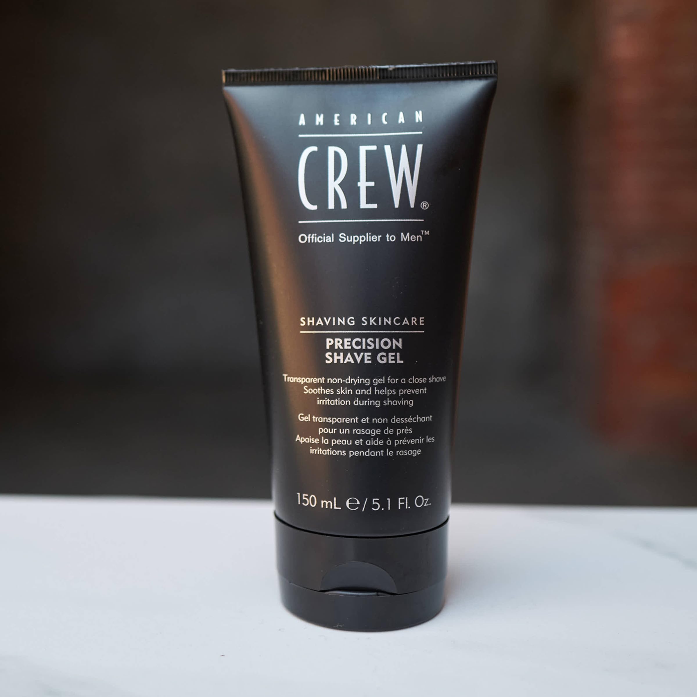 American Crew shave gel wet face and thin layer application benefit
