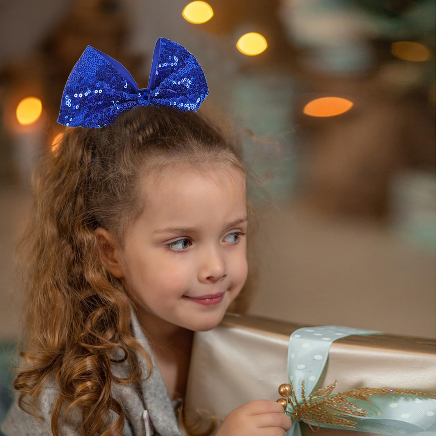 AMYDECOR jumbo glitter cheer bow clip shows alligator clip for secure hold during practice.