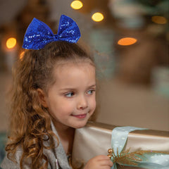 AMYDECOR jumbo glitter cheer bow clip shows alligator clip for secure hold during practice.