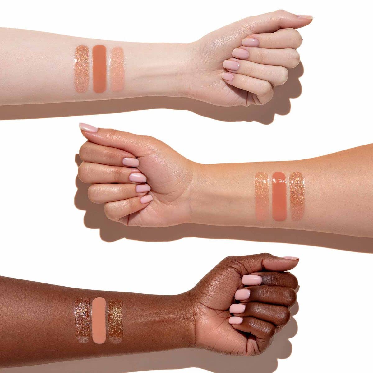 Anastasia Beverly Hills Lip Gloss Peachy swirl on lips enhances light-reflecting gloss.