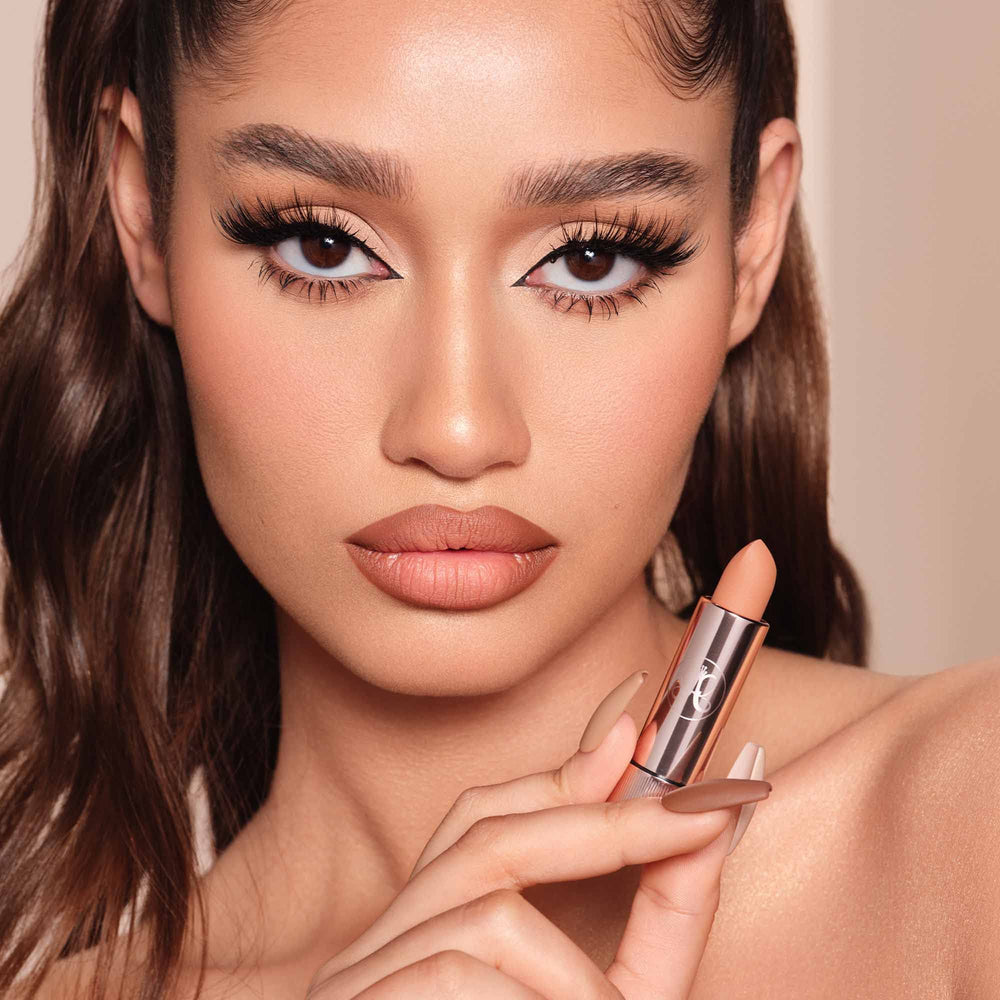 Anastasia Beverly Hills Matte Lipstick Blush Brown on lips shows buildable color.