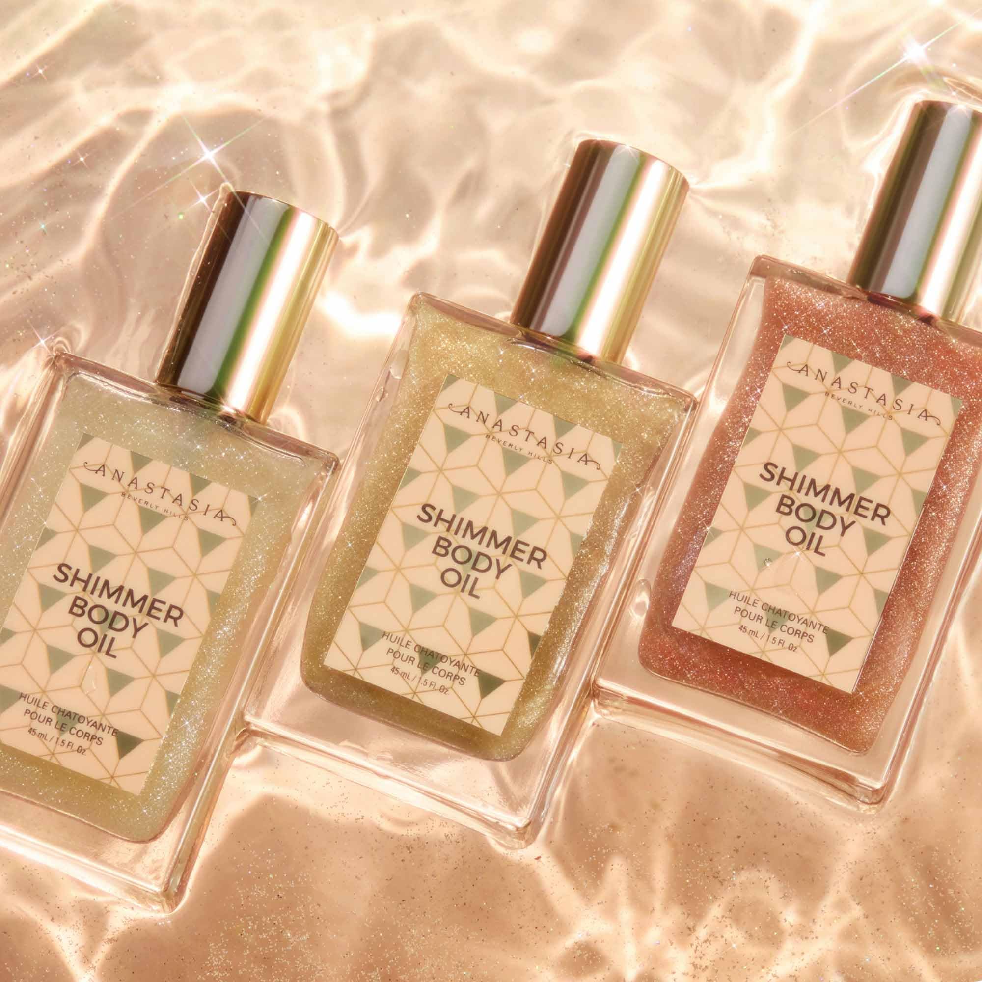 Anastasia Beverly Hills Shimmer Body Oil Rose Gold pump applicator demonstrates easy misting and blending.