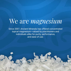 Ancient Minerals bath flakes pour image emphasizing easy-to-dissolve formula for bath or foot soak.