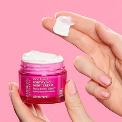 Andalou Naturals night cream bottle closeup highlights creamy texture and hydration.