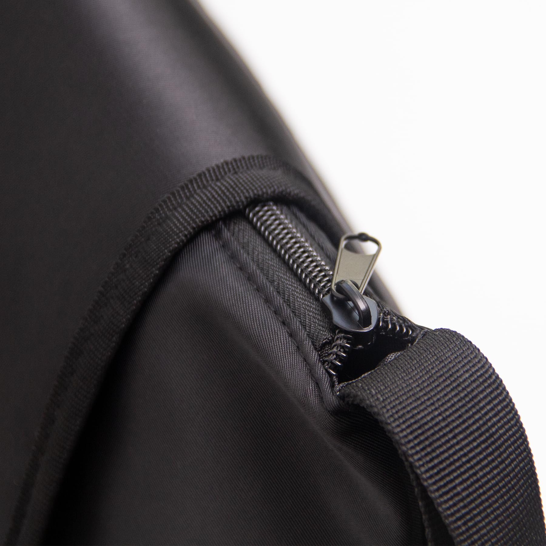 ANGENIL bag laid flat on a desk with handle for easy access