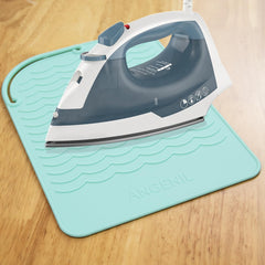 ANGENIL heat-resistant mat shown with hot tools preventing slips on wave-textured surface
