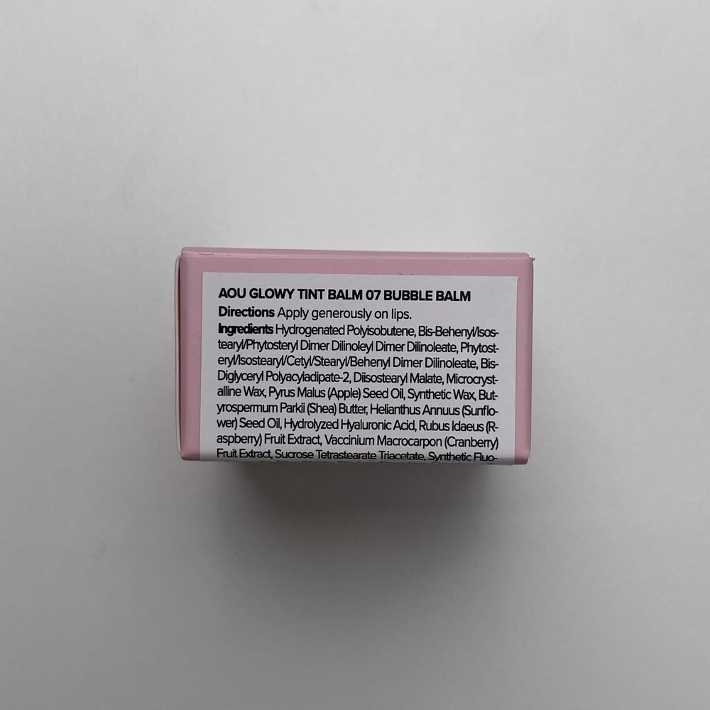 AOU GLOWY TINT BALM application on lips for daily color and moisture.
