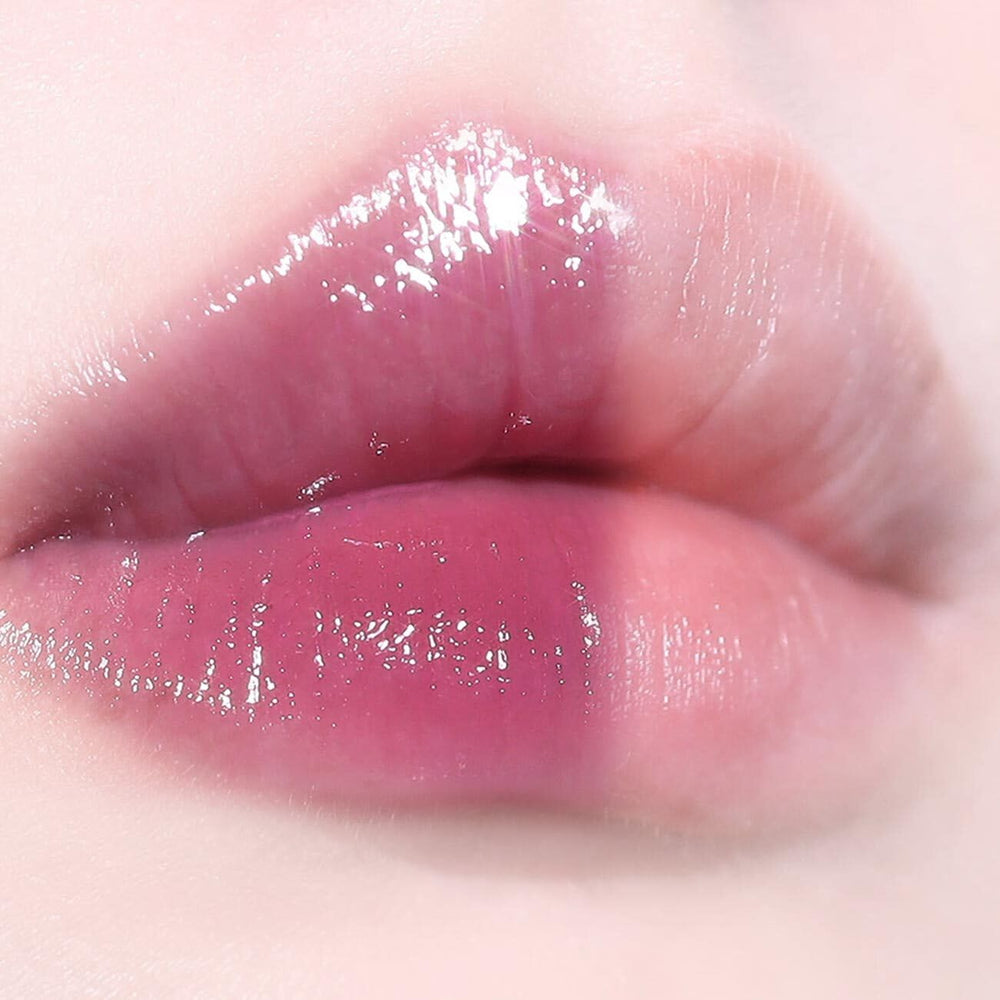 AOU Glowy Tint Balm lip application closeup highlights glossy finish and even color.