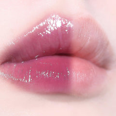AOU Glowy Tint Balm lip application closeup highlights glossy finish and even color.