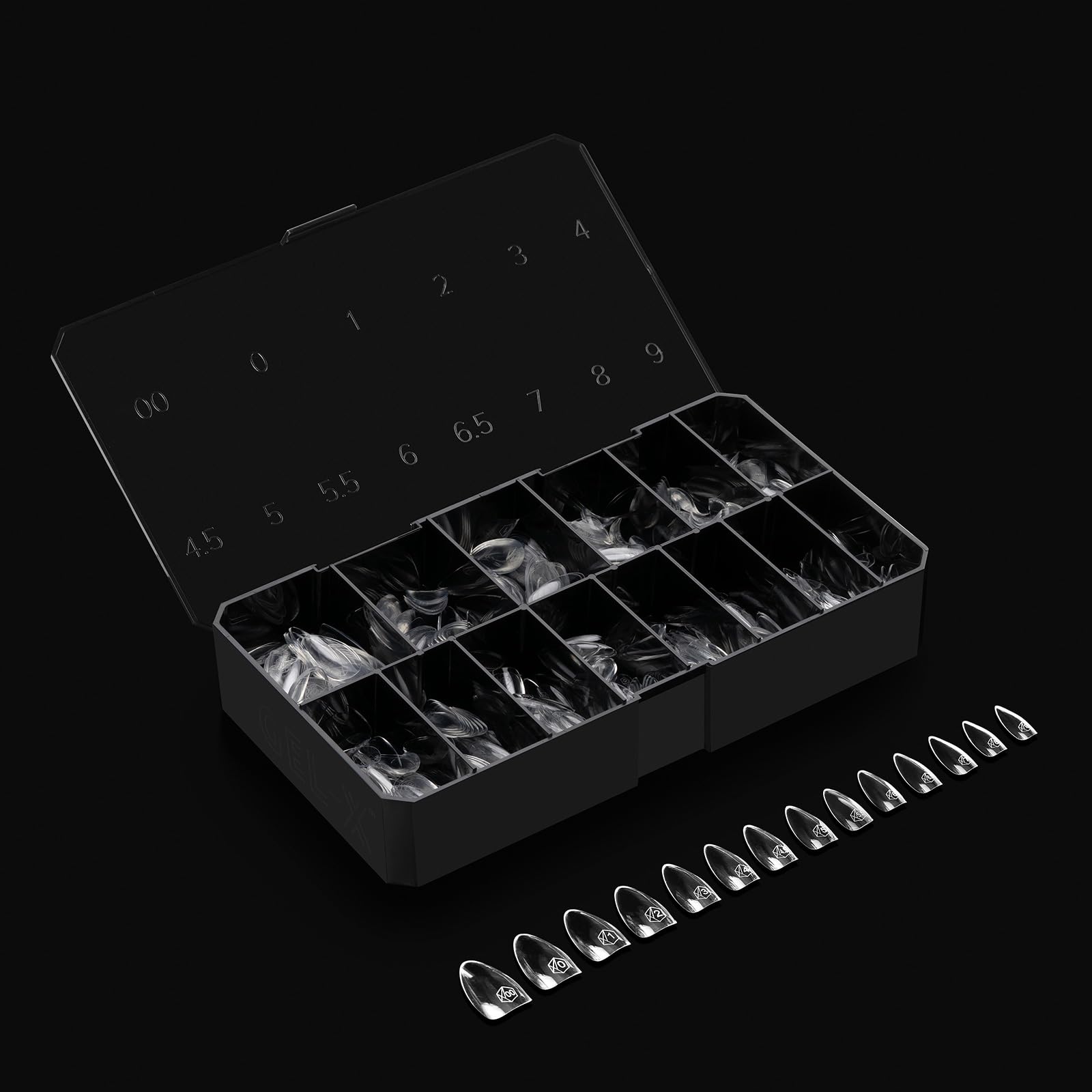 APRÉS Gel-X natural line tips on flat surface for wider nail beds.