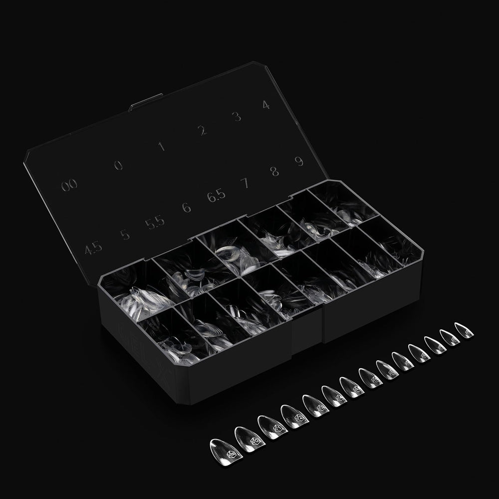 APRÉS Gel-X natural line tips on flat surface for wider nail beds.