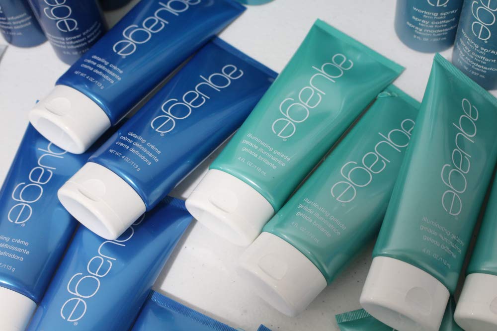 Aquage Freezing Spray nozzle closeup emphasizes professional formula and low VOC benefits.