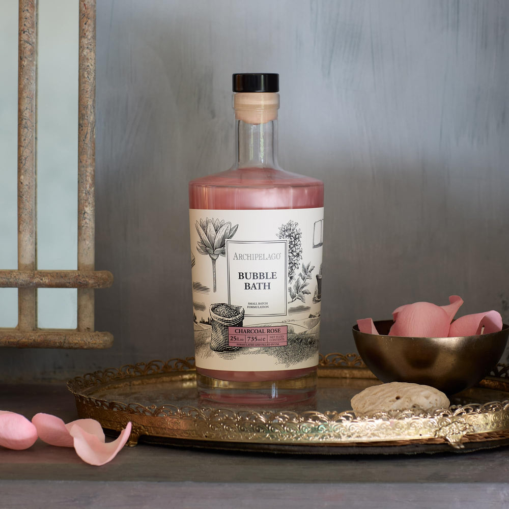 Archipelago Botanicals Charcoal Rose Bubble Bath bubbles rise for a hydrating spa-like soak.
