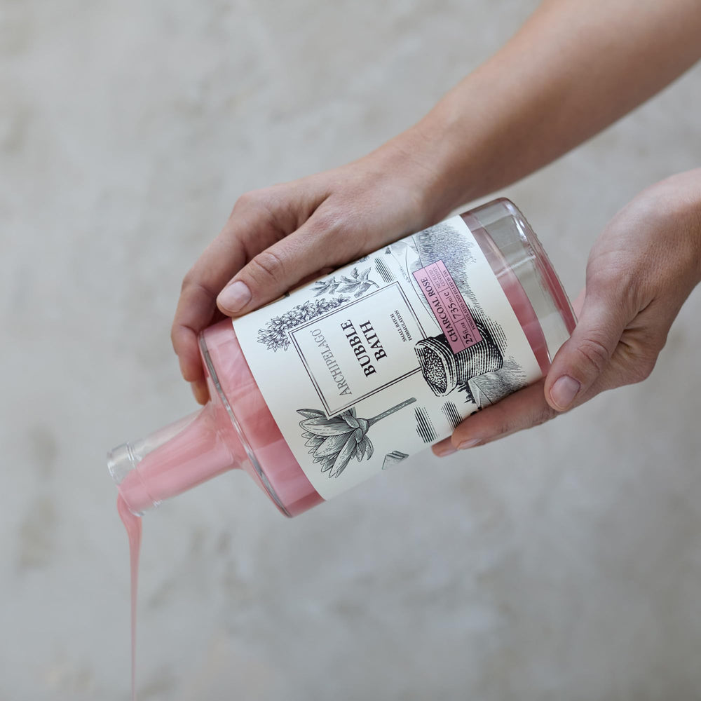 Archipelago Botanicals Charcoal Rose Bubble Bath texture close-up showcases detoxifying charcoal.