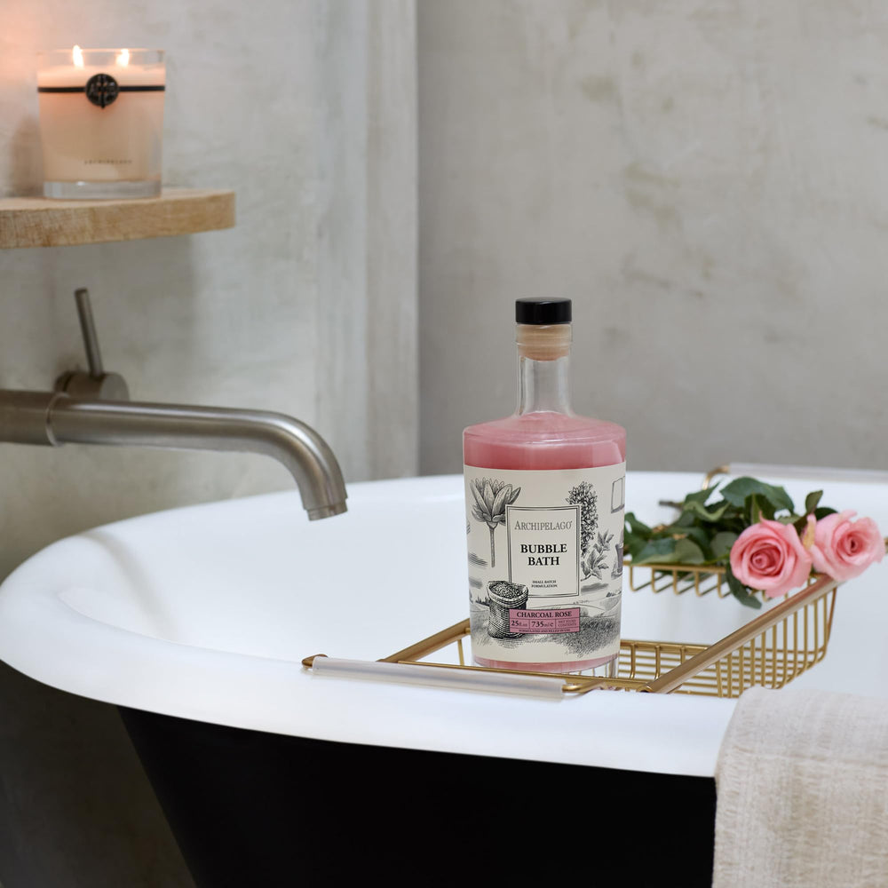 Archipelago Botanicals Bubble Bath product shot with rose petals hints at luxury.