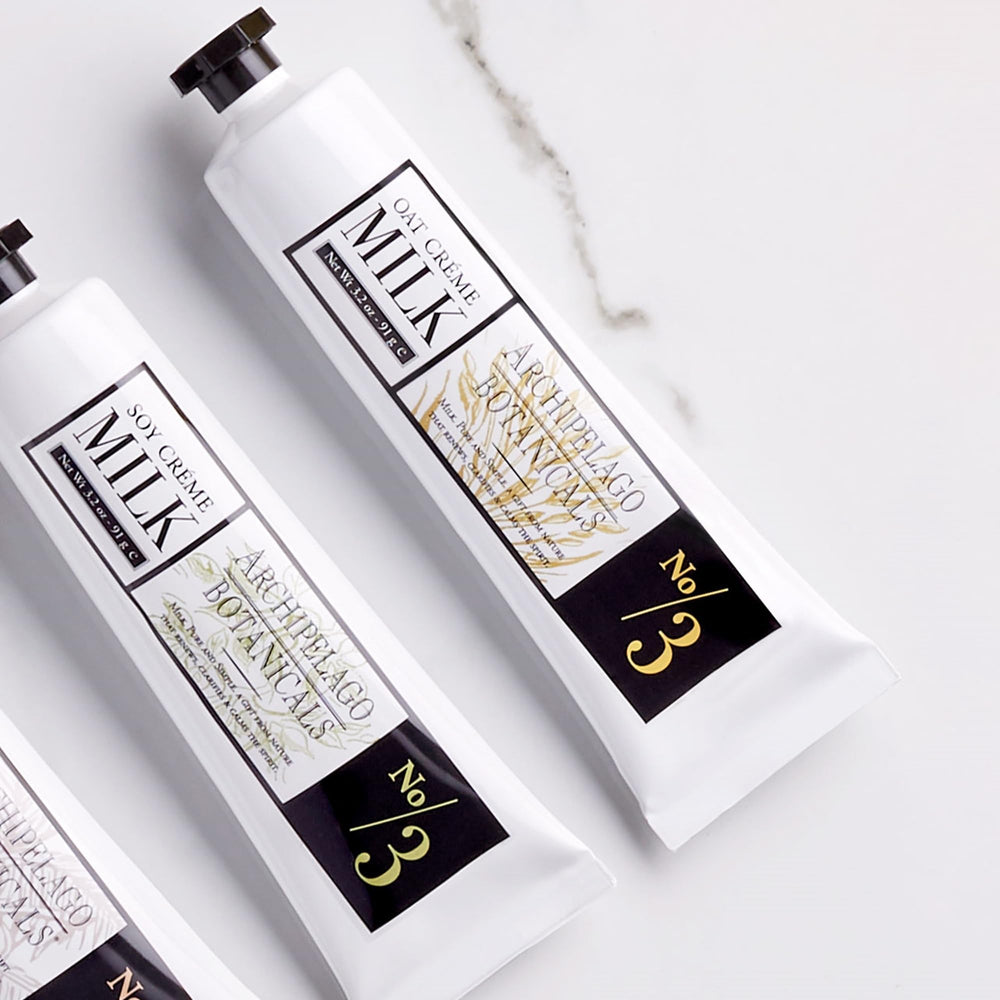 Archipelago Botanicals Oat Milk Hand Crème being applied shows fast-absorption during busy day.