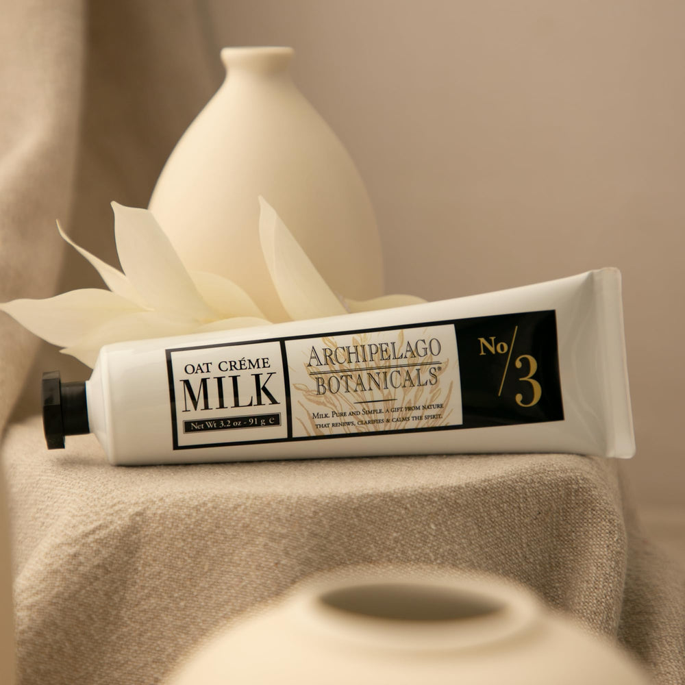 Archipelago Botanicals Oat Milk Hand Crème on dry hands demonstrates smoothing relief.
