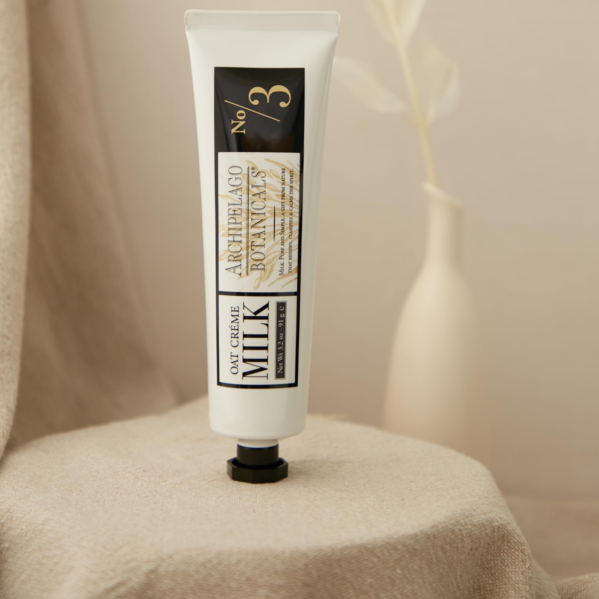Archipelago Botanicals Oat Milk Hand Crème texture close-up emphasizes rich yet light feel.