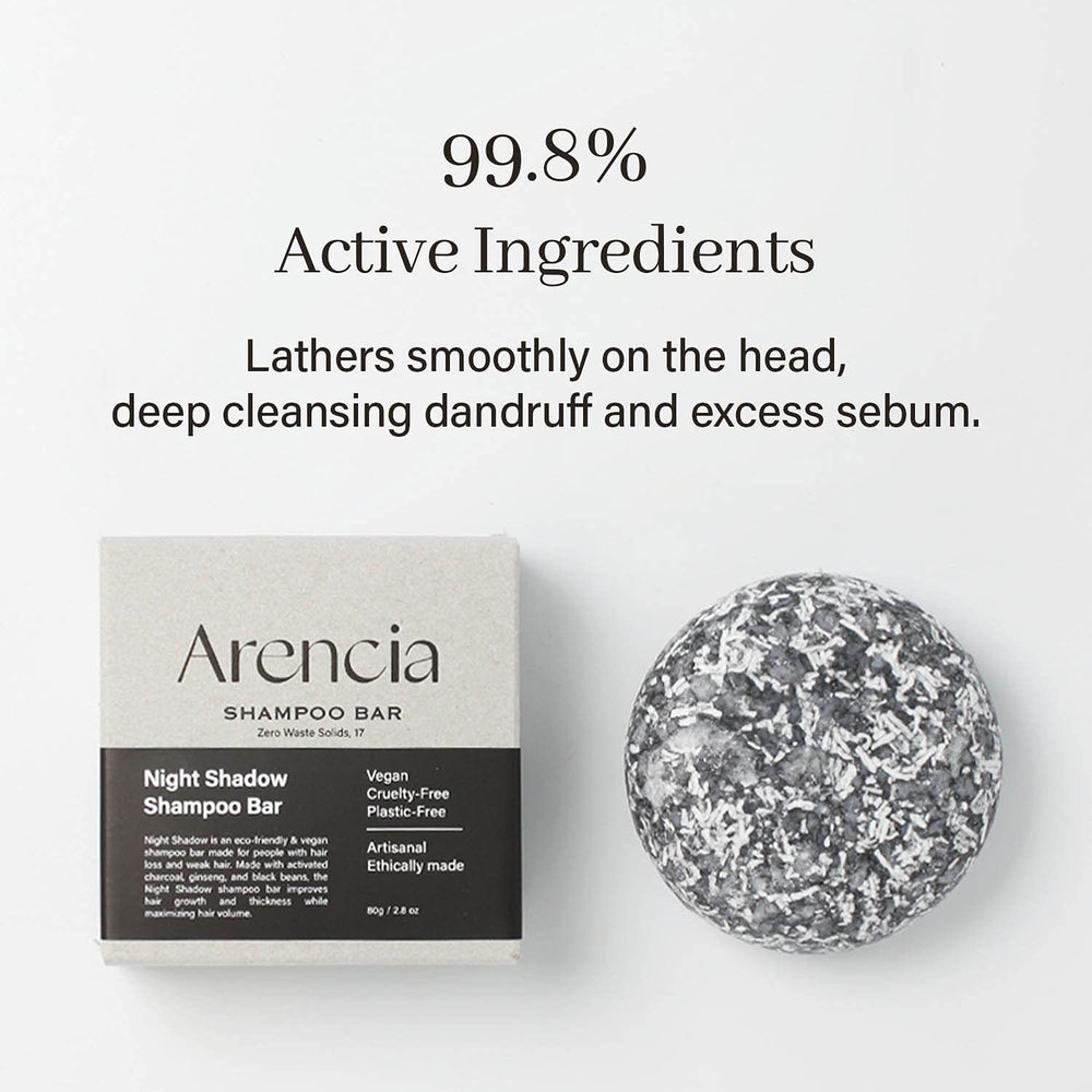 ARENCIA Night Shadow shampoo bar in hand; shows lather-ready cleansing.