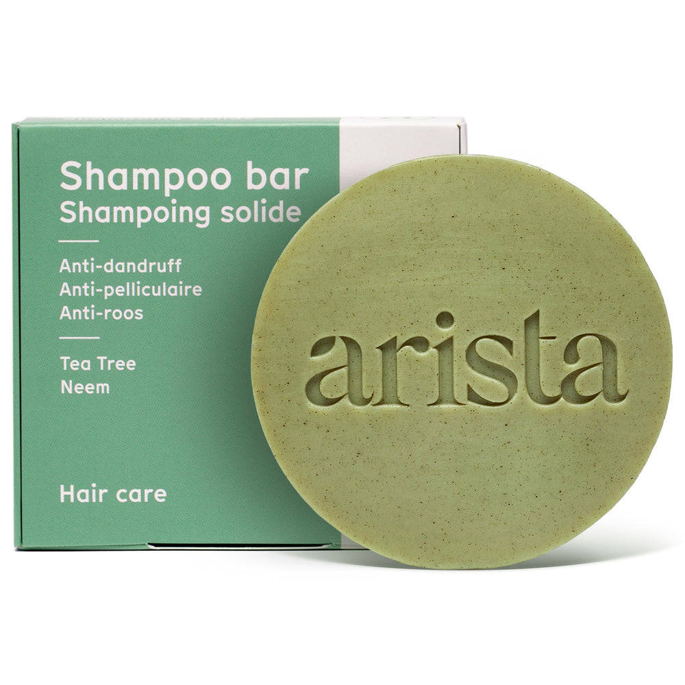Arista Ayurveda shampoo bar bottle pour for easy application and travel-friendly use.