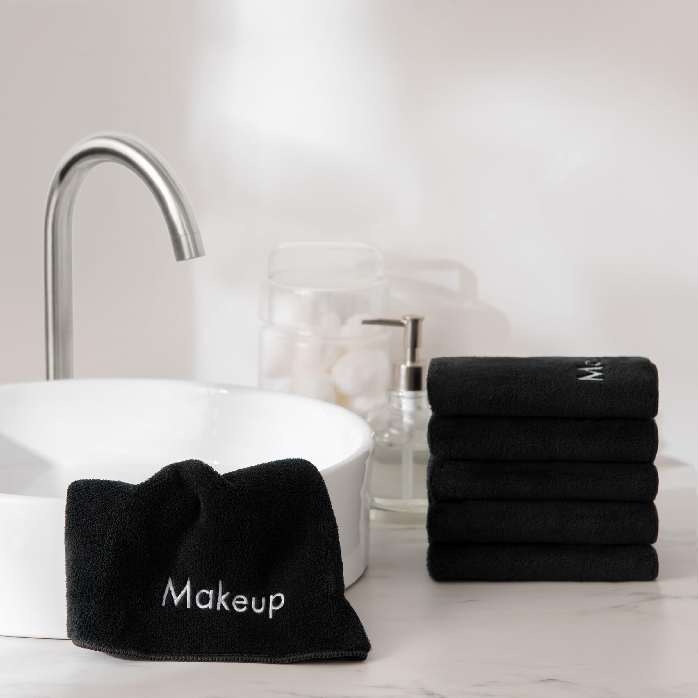 Arkwright makeup towels displayed in a stylish bathroom setting.