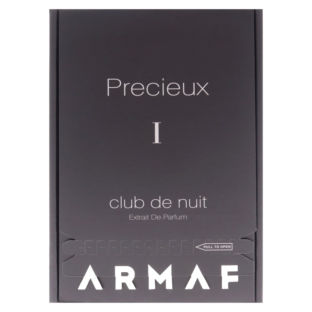 Armaf Club De Nuit Precieux 1 luxe flacon beside a suit for formal occasions