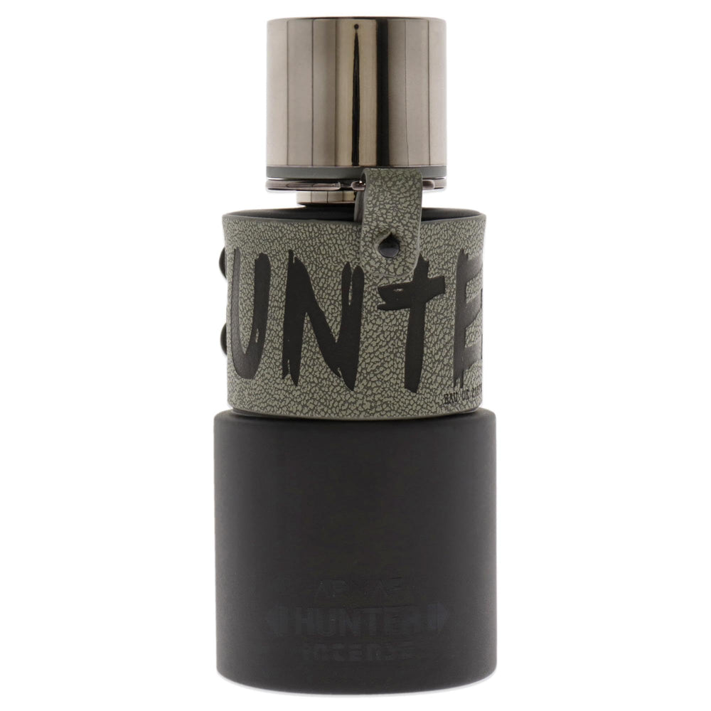 Armaf Hunter Intense bottle pour close-up showing citrus top notes ready to energize.