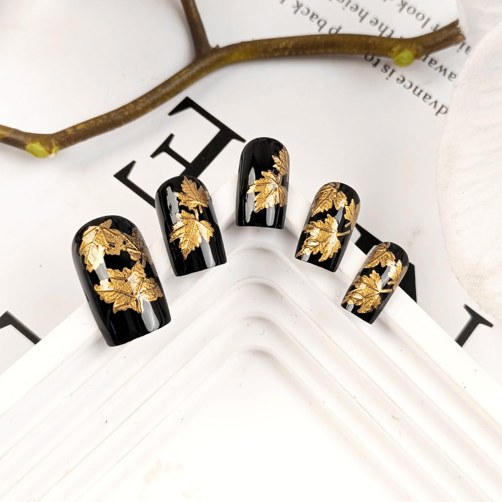 AROVFAM medium square nails with glossy gold glitter for an at-home salon vibe.