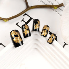 AROVFAM medium square nails with glossy gold glitter for an at-home salon vibe.