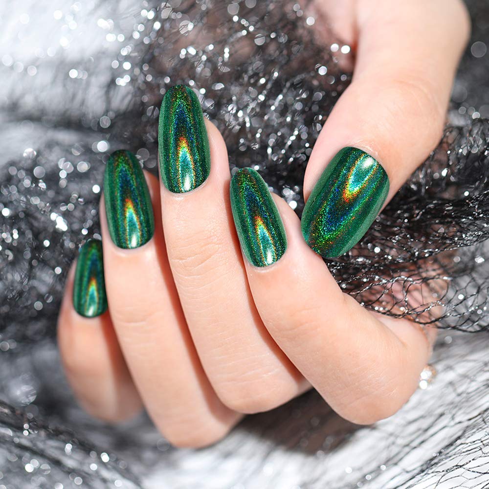 Artdone chrome powder applied on gel nails for smooth metallic glitter.